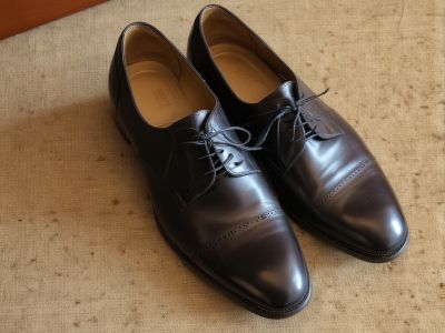 Before: Dull and worn dress shoes
